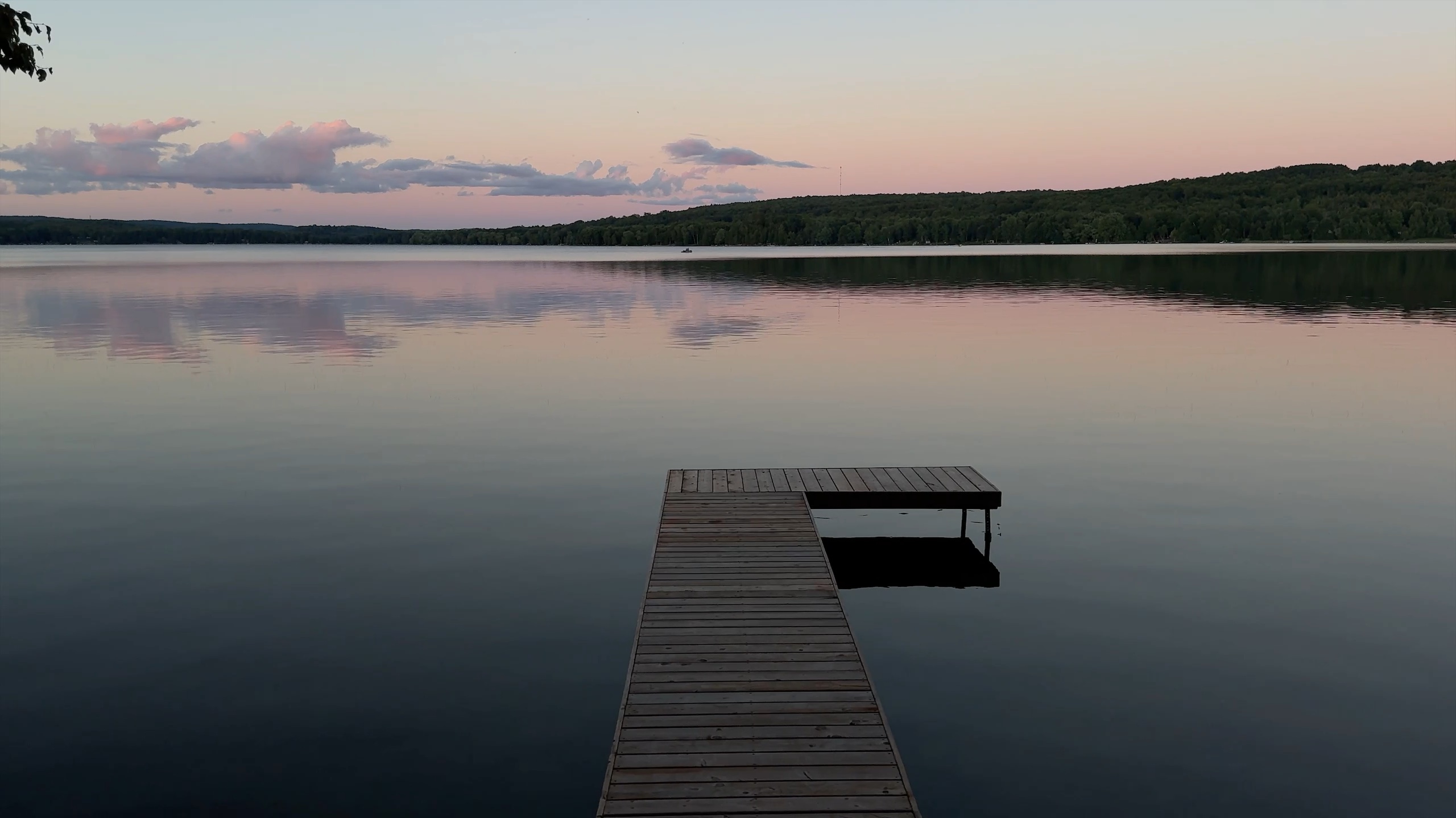 The dock at dusk, the lake perfectly still