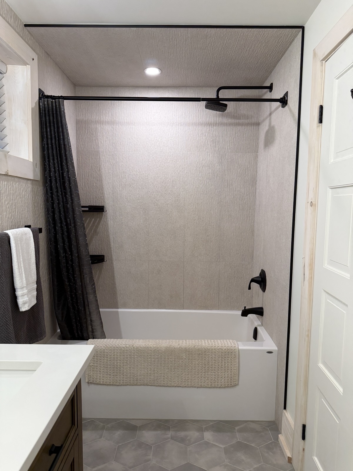 The lower bath with its tub and shower