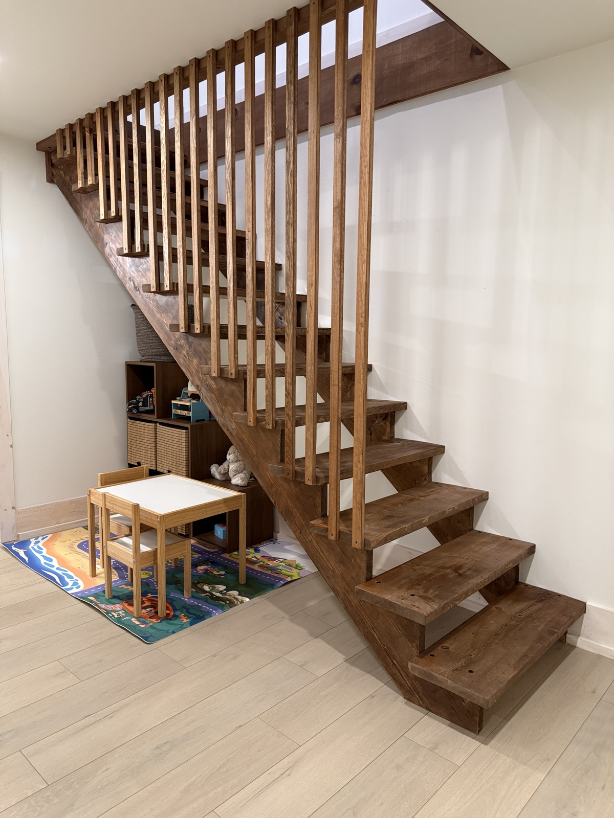 Open-riser wood stairs with a slat railing