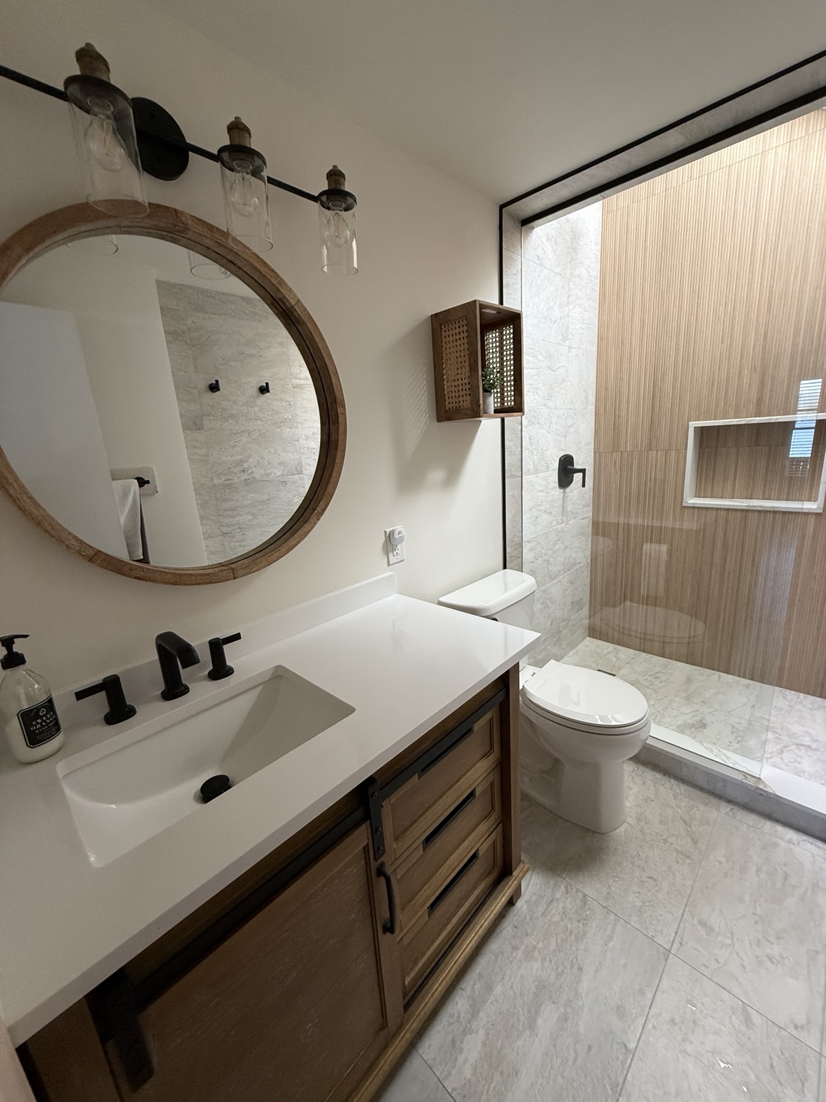 The upstairs bath with its vanity and glass shower