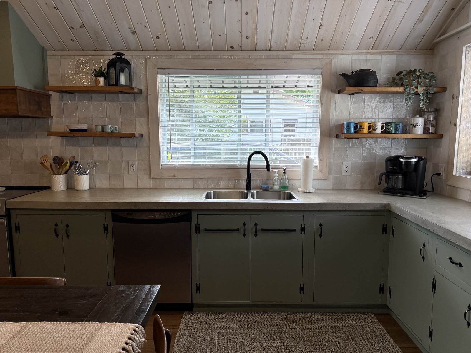 The sink under the window and the dishwasher