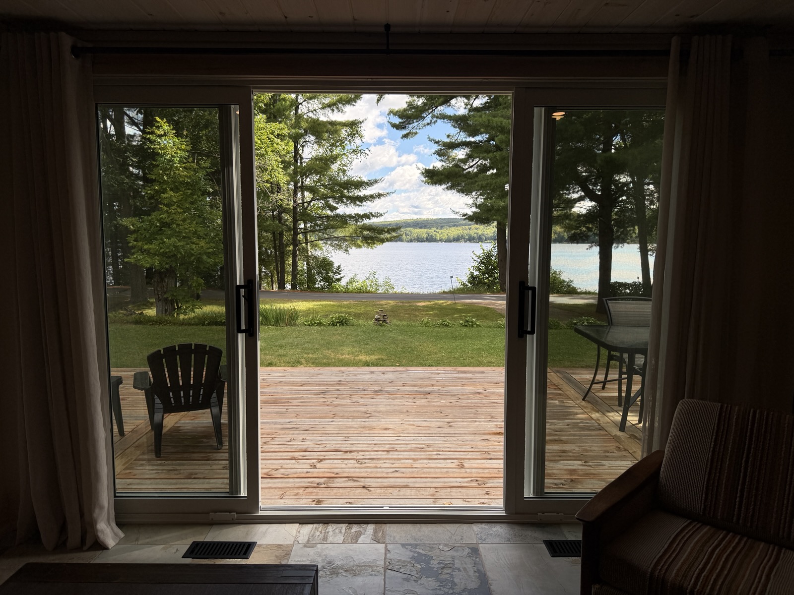 The living room sliders open onto the deck and the lake