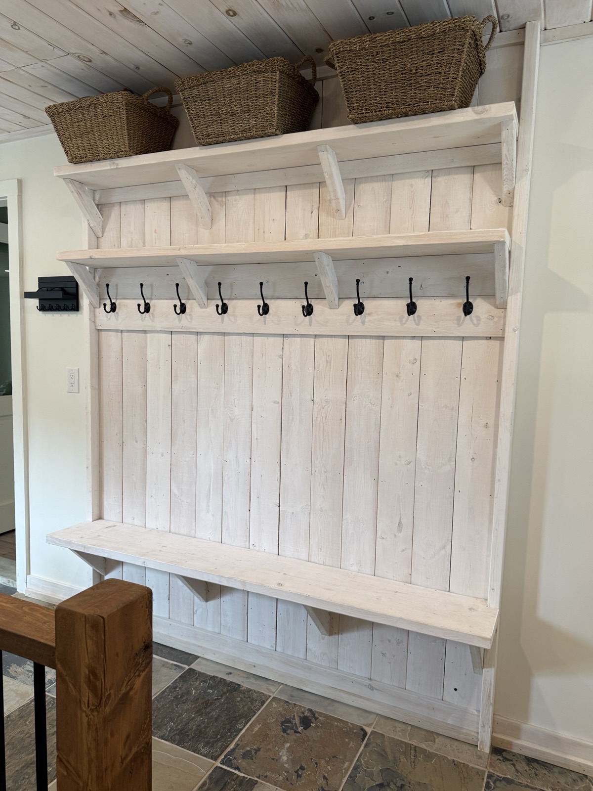 The mudroom bench with hooks and baskets