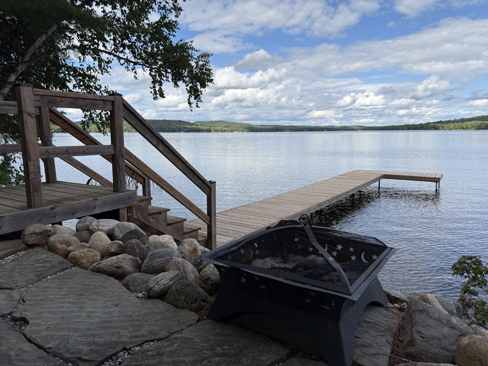 The fire pit beside the dock steps at the water